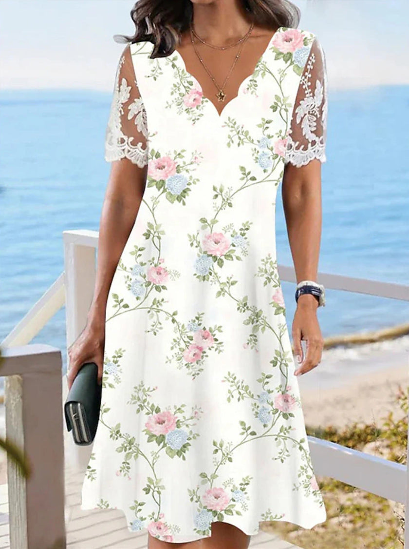 FJØRNA elegant floral midi dress for women featuring a V-neck, perfect for stylish occasions and feminine comfort.