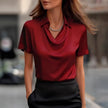 FJØRNA women's summer blouse with cowl neck and short sleeves, stylish and lightweight top for warm weather.