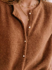 FJØRNA women's long sleeve mohair cardigan, soft and cozy, featuring a classic knit design and button closure.