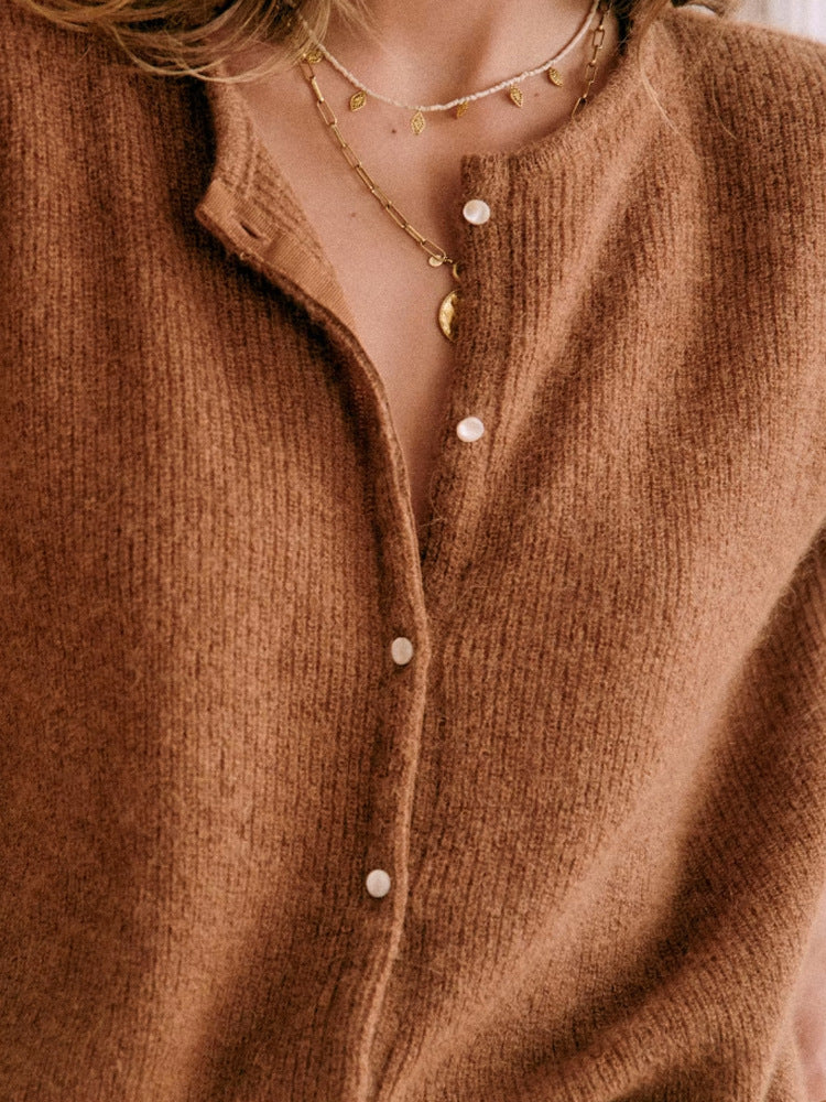 FJØRNA women's long sleeve mohair cardigan, soft and cozy, featuring a classic knit design and button closure.