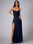 FJØRNA white maxi dress with spaghetti straps, elegant night-style dress featuring flowing fabric and a fitted waist.