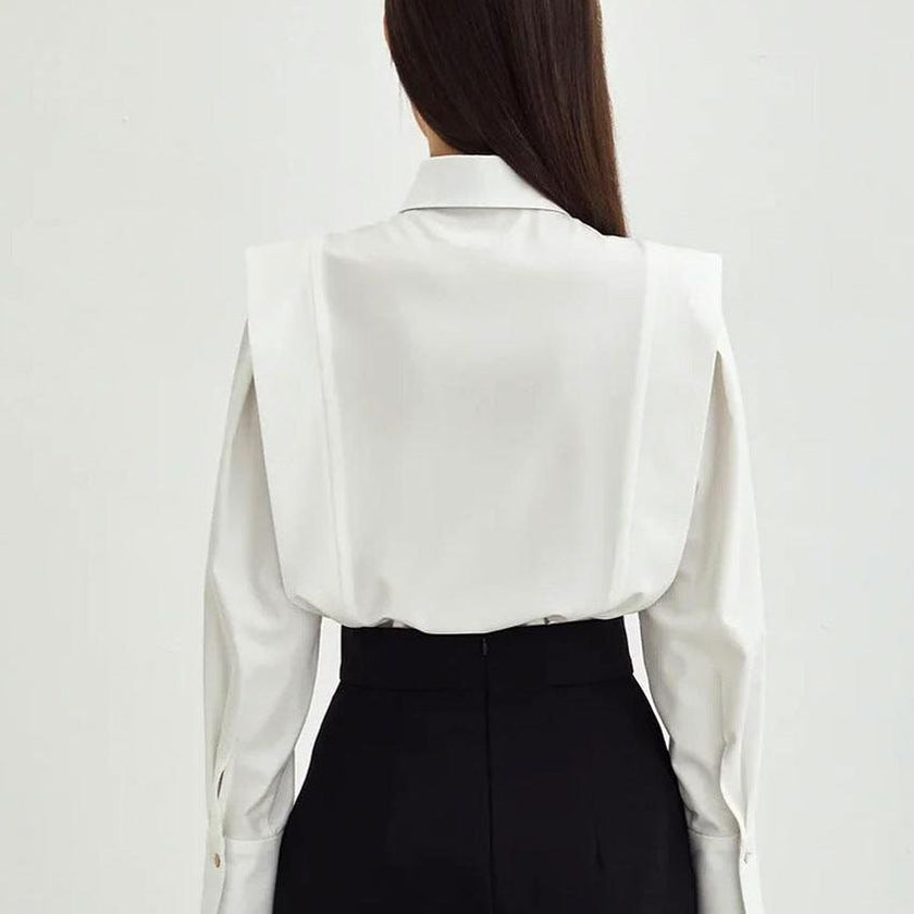 FJØRNA women's cotton blouse, stylish women's top with a relaxed fit, featuring soft fabric and a classic design.