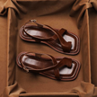 FJØRNA women's Italian leather sandals with adjustable straps and cross design, showcasing stylish footwear for women.