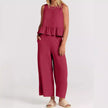 FJØRNA elegant two-piece linen ruffle co-ord set for women, featuring a stylish top and matching skirt on a white background.