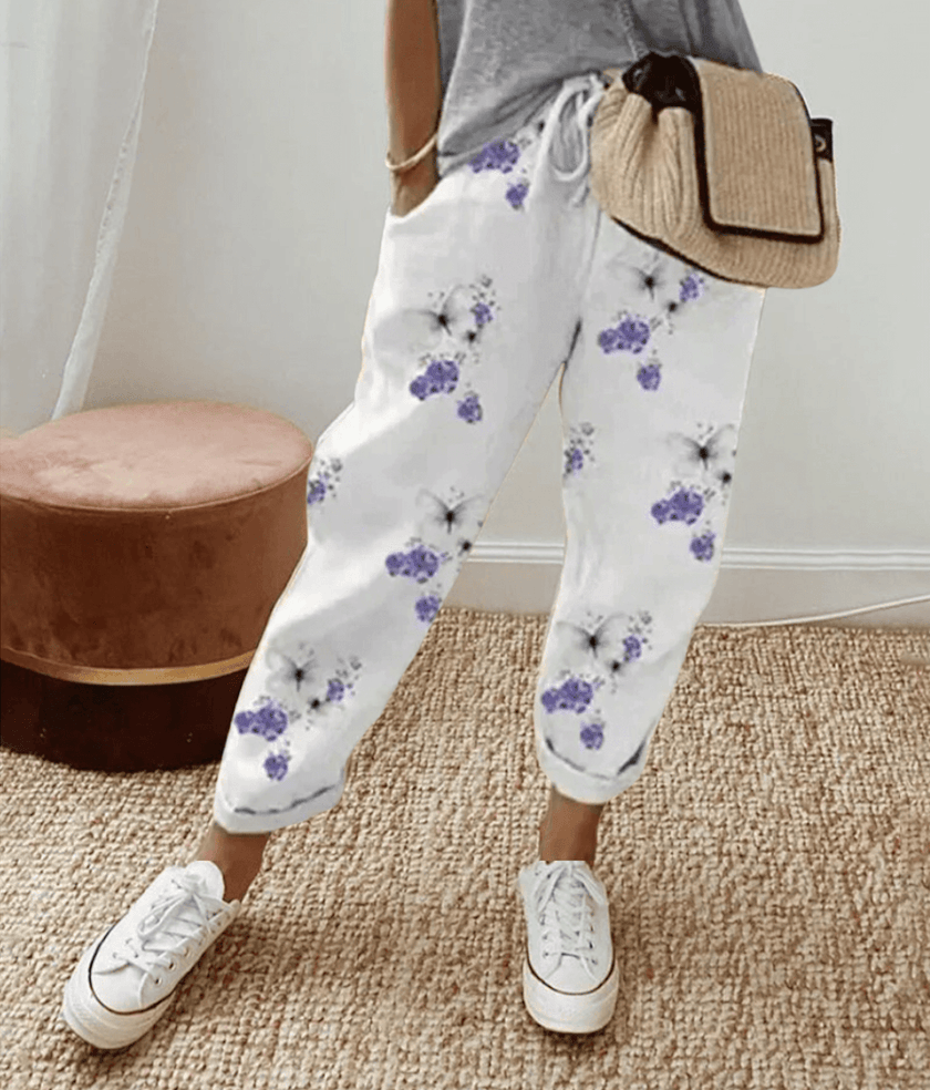 Olive green FJØRNA lightweight summer women's trousers with relaxed fit, drawstring waist, and breathable fabric.