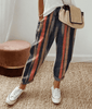 Olive green women's lightweight summer trousers by FJØRNA with relaxed fit, drawstring waist, and breathable fabric.