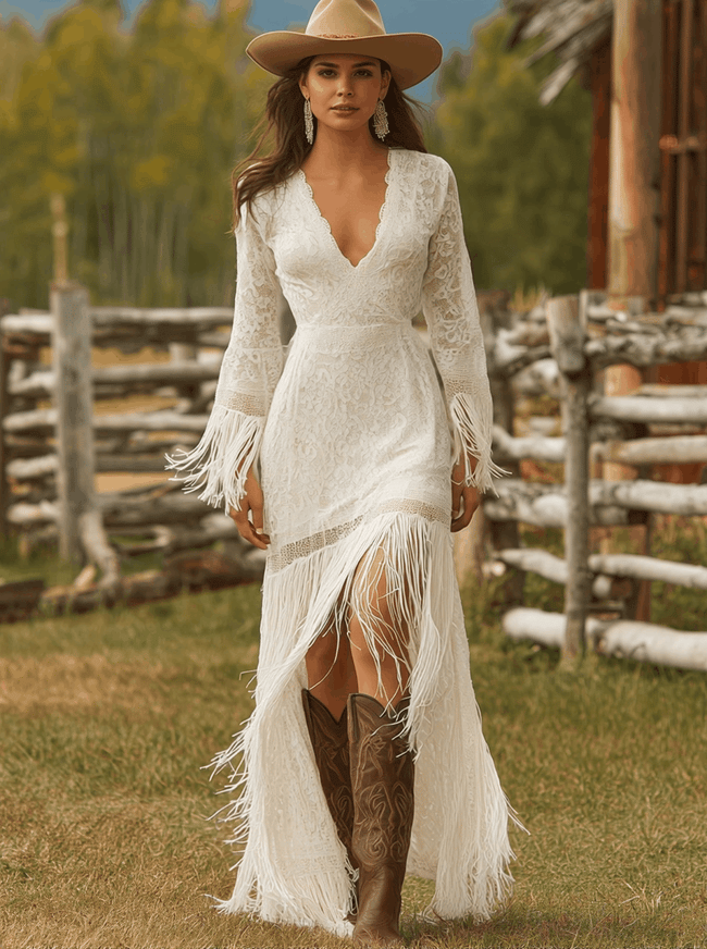 White lace V-neck maxi dress by FJØRNA featuring delicate lace fabric and flowing silhouette, perfect for elegant evening occasions.