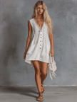 White lace V-neck mini dress by FJØRNA featuring a casual style, with delicate lace details and a fitted V-neck design.