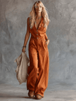 Rust orange cotton Western V-neck sleeveless jumpsuit by FJØRNA, featuring a stylish fit and casual summer style.