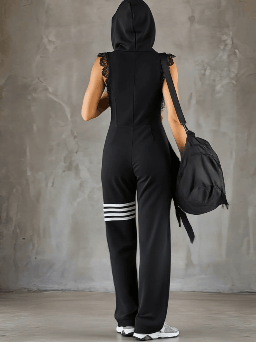 Black striped sleeveless hooded jumpsuit by FJØRNA, featuring a casual fit and stylish design, shown in the product image.