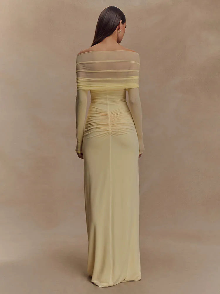 FJØRNA off-shoulder cut-out maxi dress featuring a flowing silhouette and stylish design, perfect for elegant summer occasions.