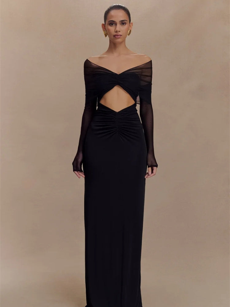 FJØRNA off-shoulder cut-out maxi dress featuring a flowing silhouette and stylish shoulder cut-outs, perfect for summer occasions.