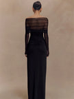 FJØRNA off-shoulder cut-out maxi dress with flowing fabric and stylish design, perfect for elegant summer occasions.