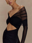 FJØRNA off-shoulder cut-out maxi dress featuring a flowing silhouette and stylish shoulder and side cut-outs.