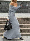 White FJØRNA off-shoulder knitted maxi dress with a fitted silhouette, styled with long sleeves and a flowing hem.