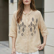 Off-white FJØRNA summer blouse for women with geometric button front and relaxed fit, stylish top for warm weather.