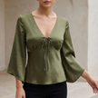 Olive green FJØRNA women's V-neck satin summer blouse with high waist, stylish top for warm weather and casual wear.