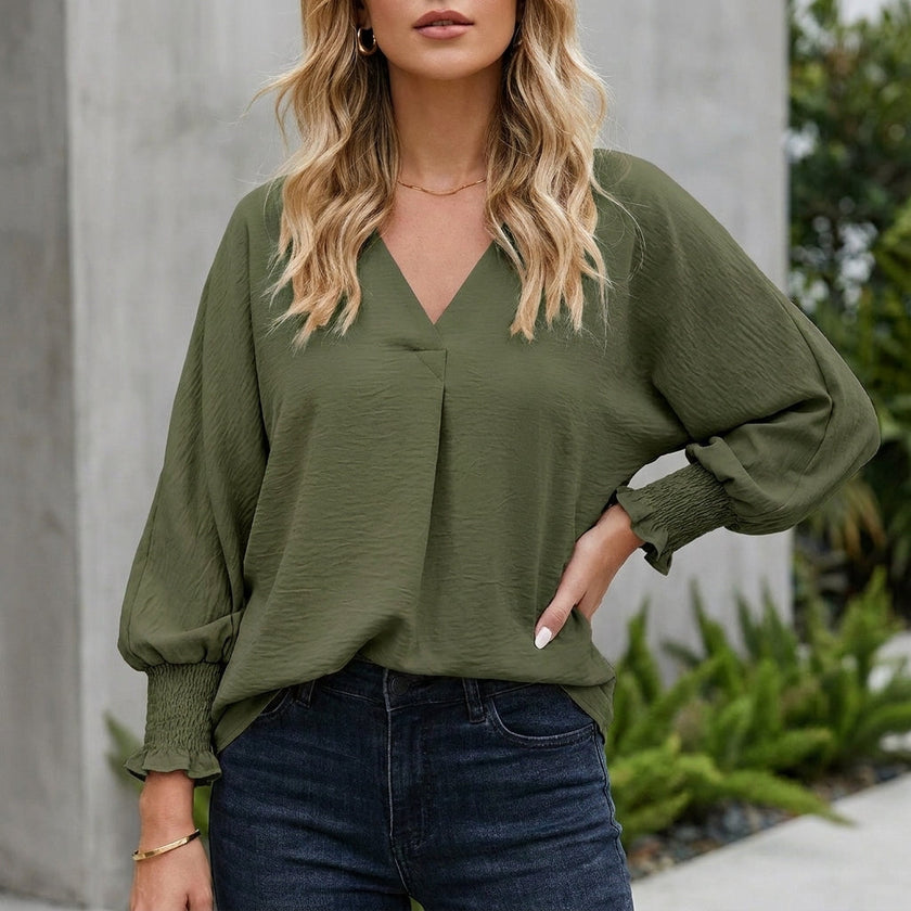 Olive green women's summer blouse by FJØRNA with V-neck, ruffle details, lightweight denim fabric, perfect for warm weather.