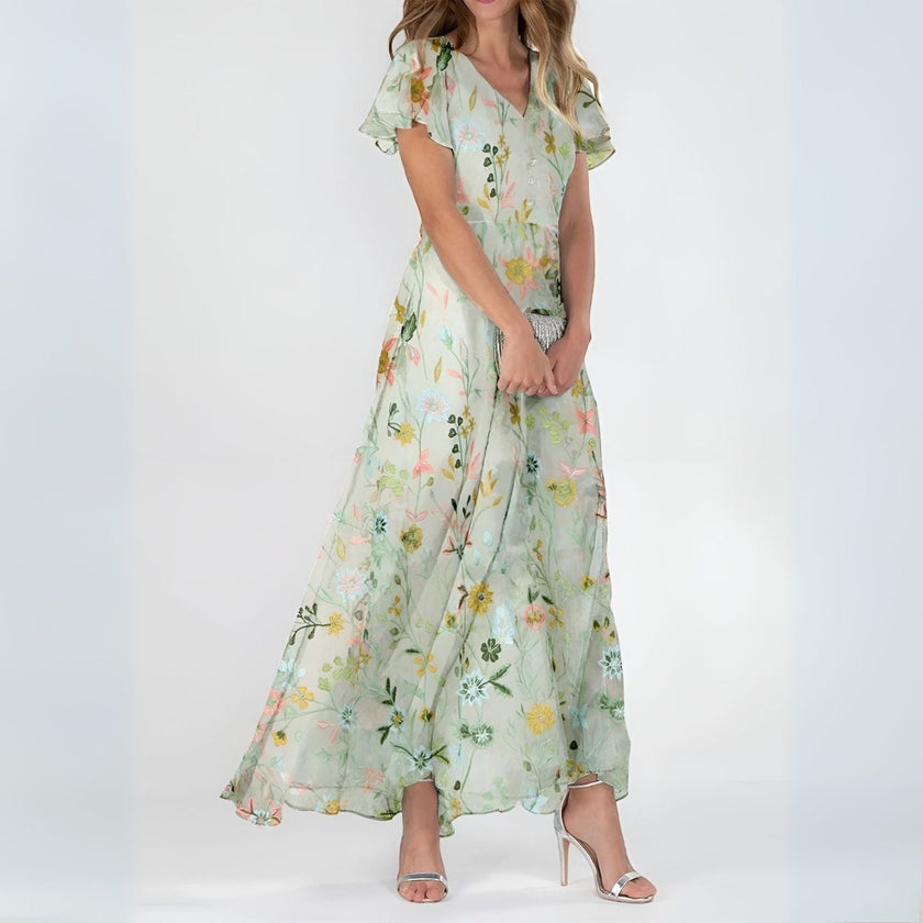 Elegant mini dress for women by FJØRNA, featuring a flowy design suitable for evening and special occasions.