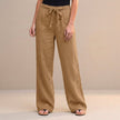 Orange-brown high-waist summer trousers for women by FJØRNA, made of lightweight cotton, styled for casual warm-weather wear.