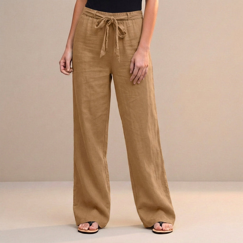 Orange-brown high-waist summer trousers for women by FJØRNA, made of lightweight cotton, styled for casual warm-weather wear.