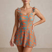 Orange and green ruffle floral summer swimsuit for women by FJØRNA, featuring a stylish and vibrant swimwear design.