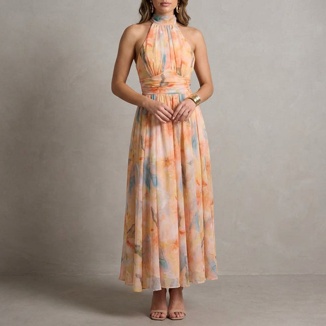 Orange FJØRNA elegant maxi dress for women with halter neck and flowy design, perfect for stylish summer occasions.