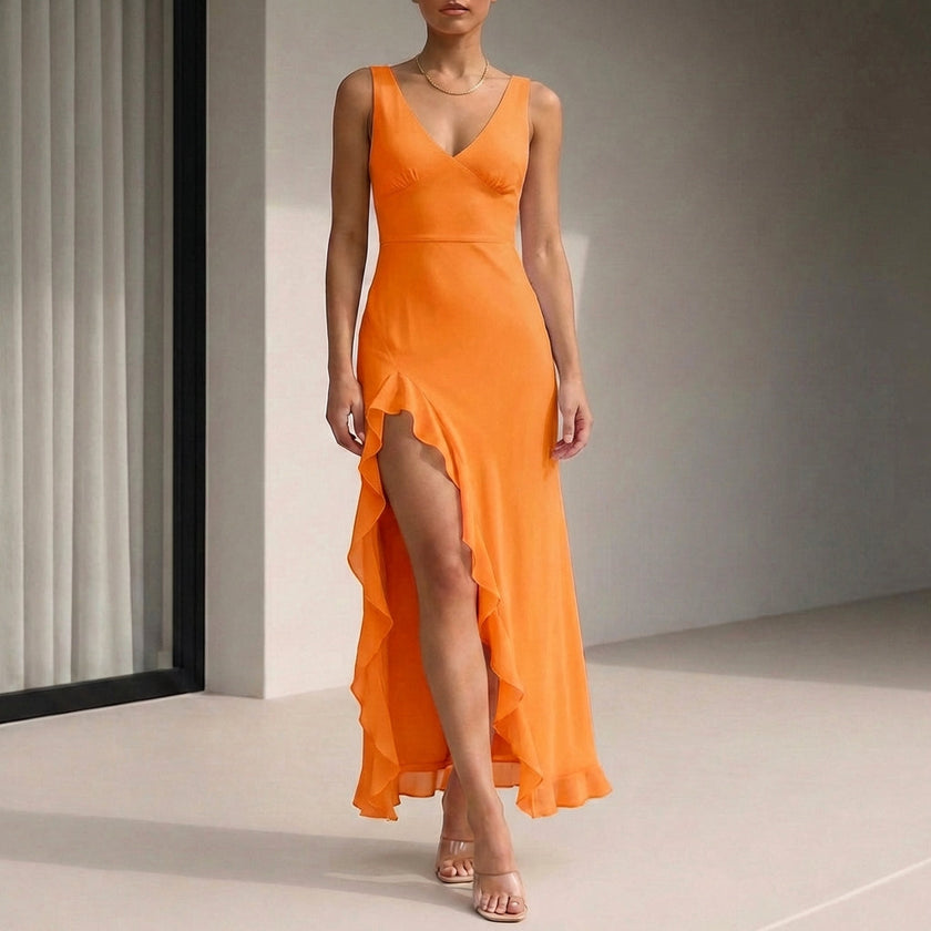Orange FJØRNA fitted sleeveless maxi dress with ruffled high slit, flowing fabric and elegant design for summer wear.