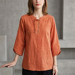 Orange denim tassel summer blouse for women by FJØRNA, featuring a stylish sleeveless top with tassel accents.