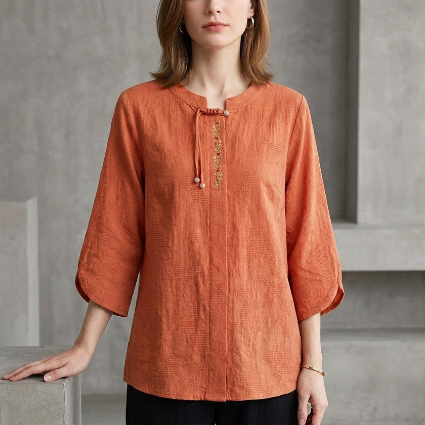 Orange denim tassel summer blouse for women by FJØRNA, featuring a stylish sleeveless top with tassel accents.
