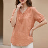 Orange floral V-neck linen summer blouse for women by FJØRNA, casual and stylish top with a relaxed fit.