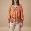 Orange floral long sleeve linen summer blouse for women by FJØRNA, featuring a stylish and comfortable design.