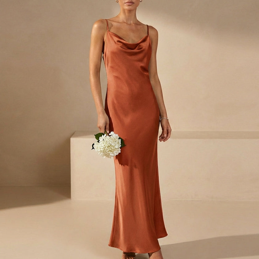 Orange satin fitted cowl neck maxi dress with spaghetti straps, perfect for evening wear by FJØRNA.