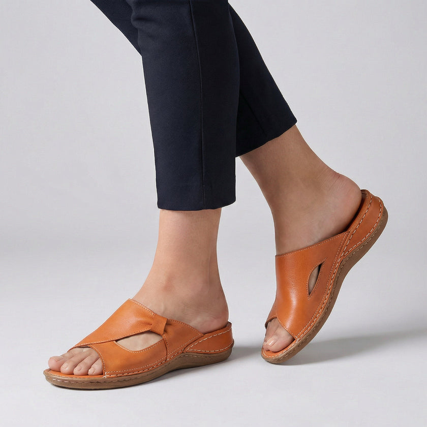 Orange FJØRNA orthopedic open-toe slide sandals for women with cushioned insoles and supportive design.