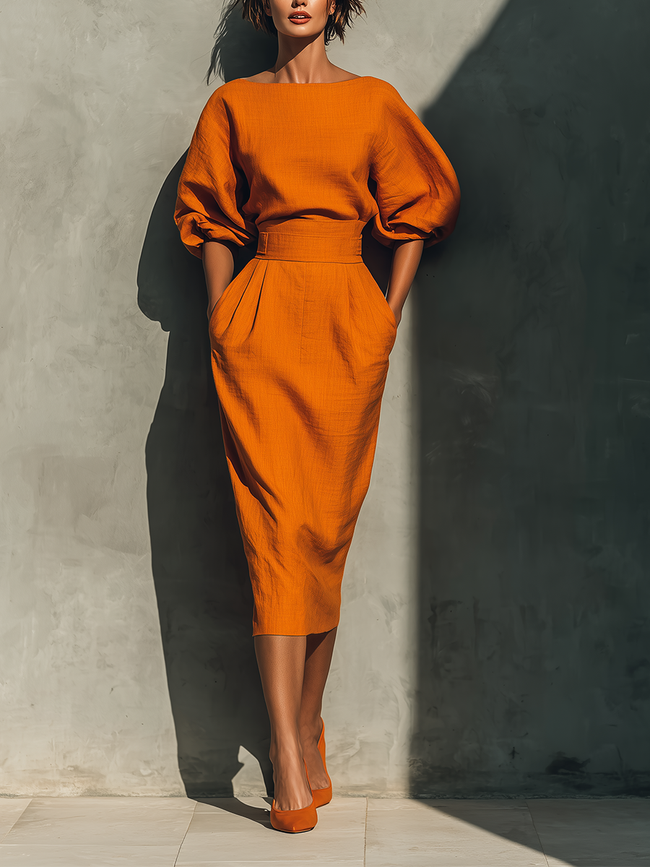 Orange linen midi dress for women by FJØRNA, featuring a flowing design with short sleeves and a midi length.