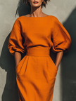 Orange linen midi dress for women by FJØRNA, showcasing a flowing design with a fitted waist and sleeveless style.