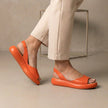 Orange FJØRNA women's orthopedic wedge sandals with adjustable straps and open-toe design for comfortable summer wear.