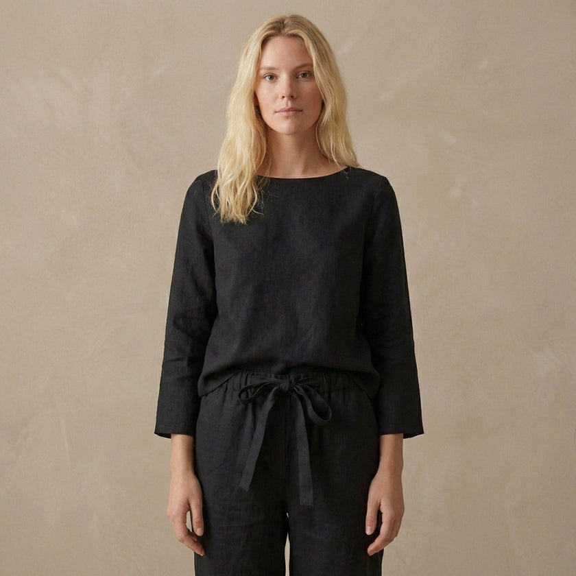 FJØRNA relaxed linen two-piece set with boat neck blouse and drawstring pants, casual and comfortable summer outfit.