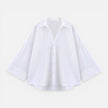 FJØRNA women's lightweight summer blouse with loose fit, perfect for vacation, shown in a relaxed oversized style.