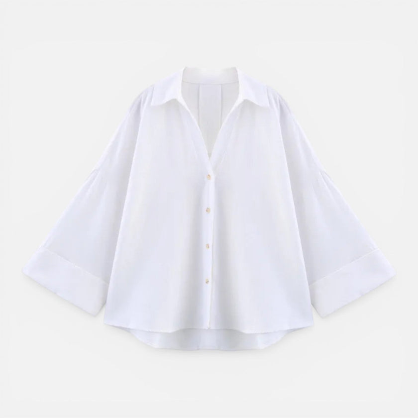 FJØRNA women's lightweight summer blouse with loose fit, perfect for vacation, shown in a relaxed oversized style.
