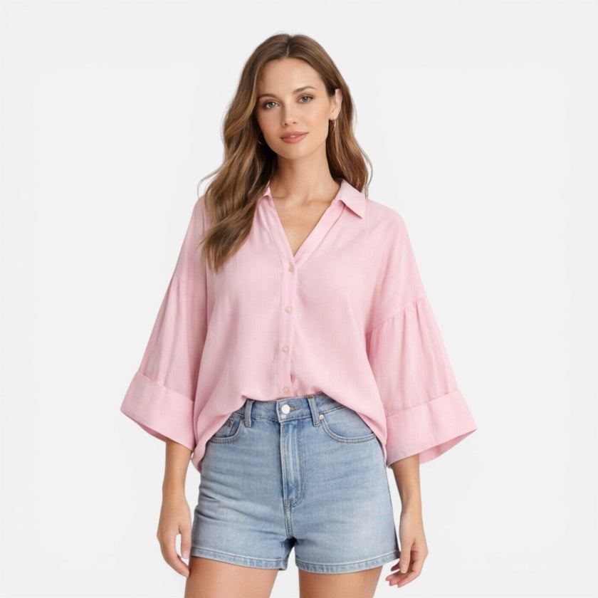 Lightweight women's summer blouse by FJØRNA, loose fit vacation shirt with relaxed style, shown in oversized fit image.