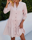 Pink gingham summer dress for women with V-neck from FJØRNA, featuring a breezy, stylish design perfect for warm weather.