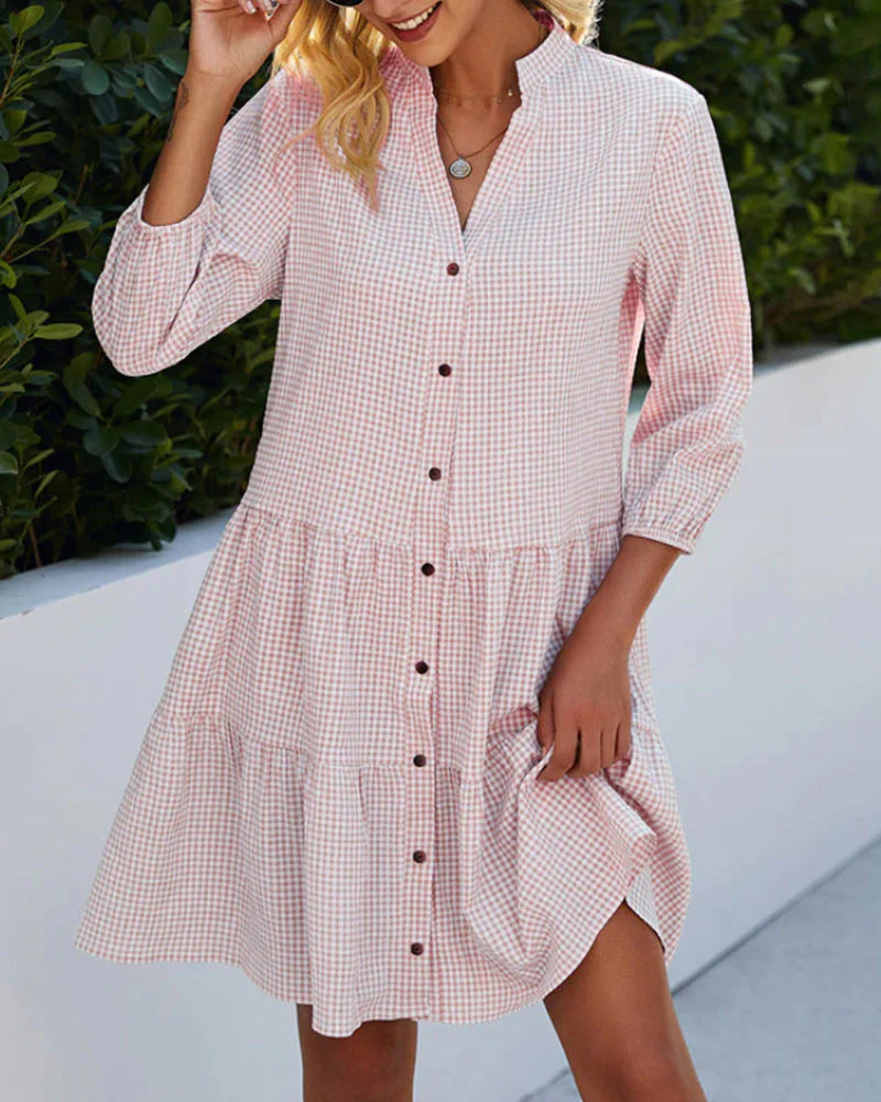 Pink gingham summer dress for women with V-neck from FJØRNA, featuring a breezy, stylish design perfect for warm weather.