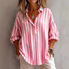 Pink FJØRNA women's summer swimsuit with a v-neck and flowy design, perfect for beach or poolside wear.