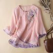 Pink floral V-neck linen blouse for women by FJØRNA, featuring lightweight fabric and stylish summer top design.