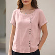 Pink relaxed linen blouse for women with asymmetric detail, stylish daywear top by FJØRNA.