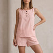 Pink FJØRNA women's two-piece co-ord set with button-front top and matching pants, stylish and elegant women's clothing ensemble.