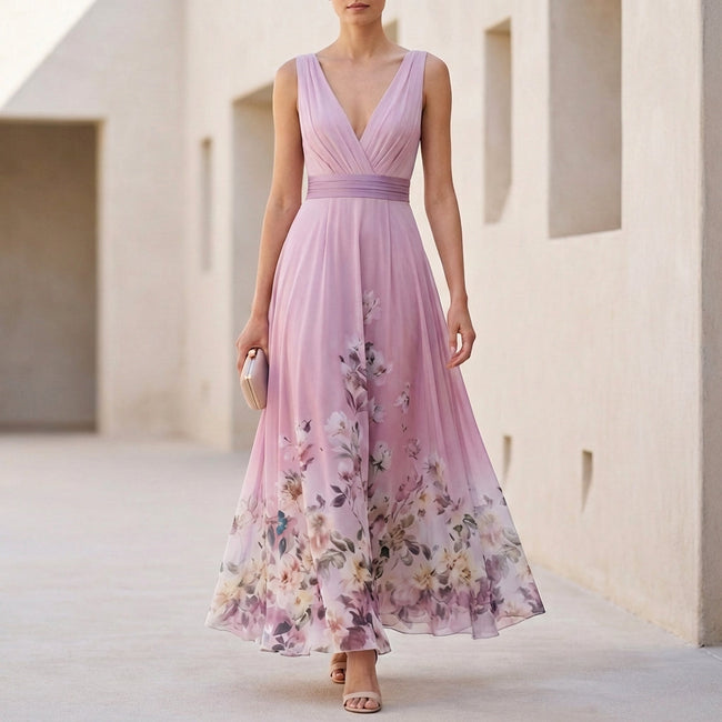 Pink floral A-line maxi dress with sleeveless V-neck by FJØRNA, flowing fabric and elegant design perfect for summer wear.