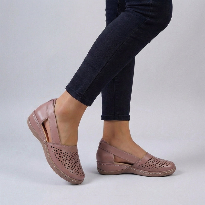 Pink FJØRNA orthopedic wedge sandals with scalloped trim and side cut-outs, showcasing stylish and comfortable footwear design.