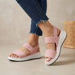 Pink FJØRNA women's orthopedic sandals with adjustable straps and flowy design, showcasing their comfortable and stylish profile.